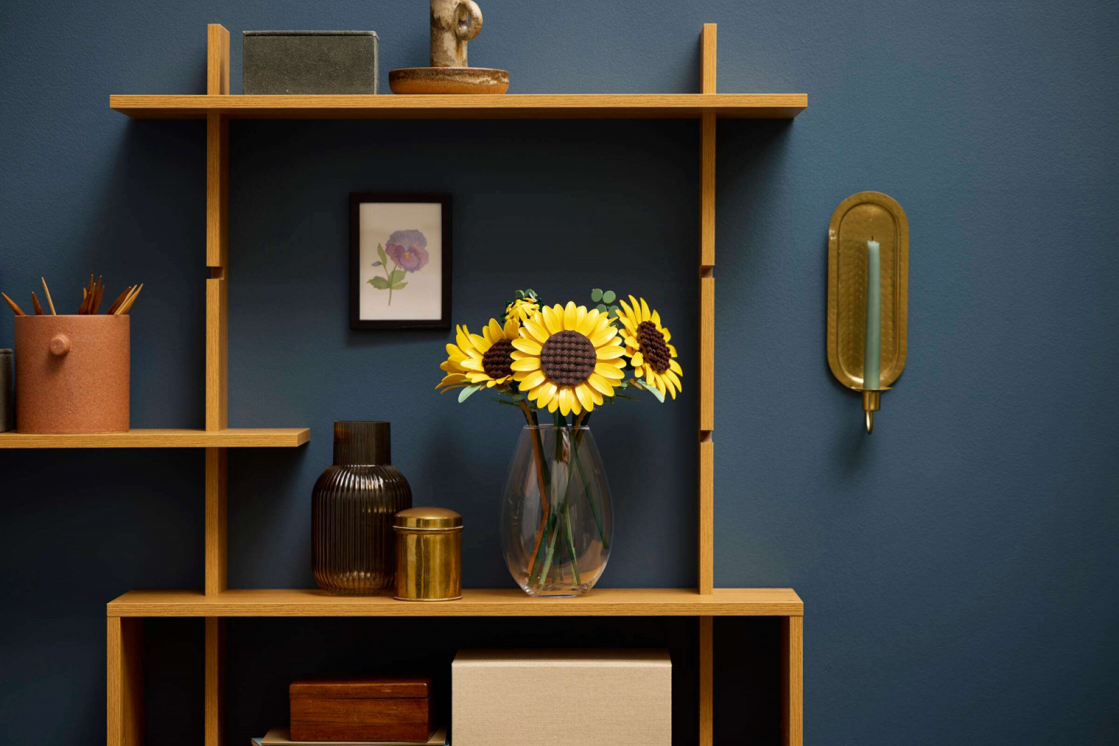 The Lego Sunflowers have adjustable stems so that they can be arranged in any container. The three fully open flower heads reach 33-36 centimetres in height, with eucalyptus stems providing a background fill