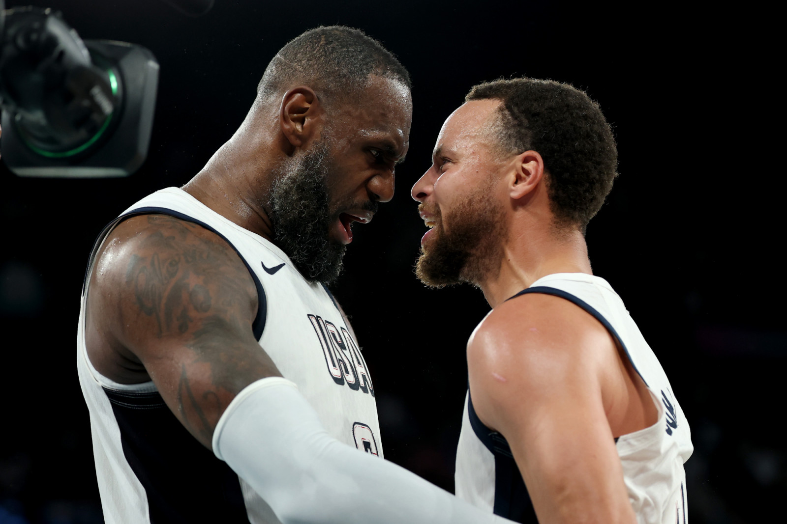 LeBron James #6 and Stephen Curry #4 of Team United States celebrate after their team's win against Team Serbia during a Men's basketball semifinals match between Team United States and Team Serbia on day thirteen of the Olympic Games Paris 2024 at Bercy Arena on August 08, 2024 in Paris, France. (Photo by Gregory Shamus/Getty Images)
