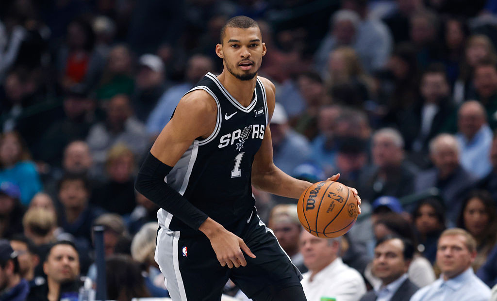 Victor Wembanyama #1 of the San Antonio Spurs handles the ball during the game against the Dallas Mavericks at American Airlines Center on February 5, 2026 in Dallas, Texas. (Photo by Ron Jenkins/Getty Images)