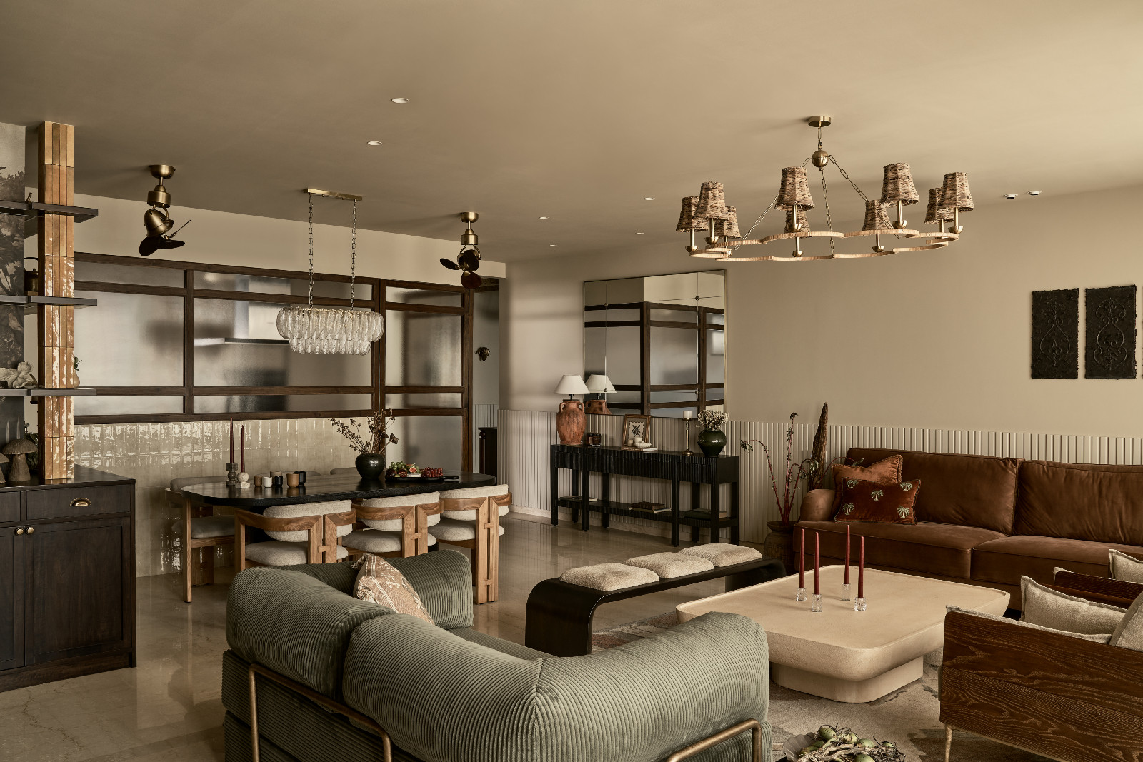 The open-plan living room and dining room of a Mumbai, India apartment designed by Dusq Studio