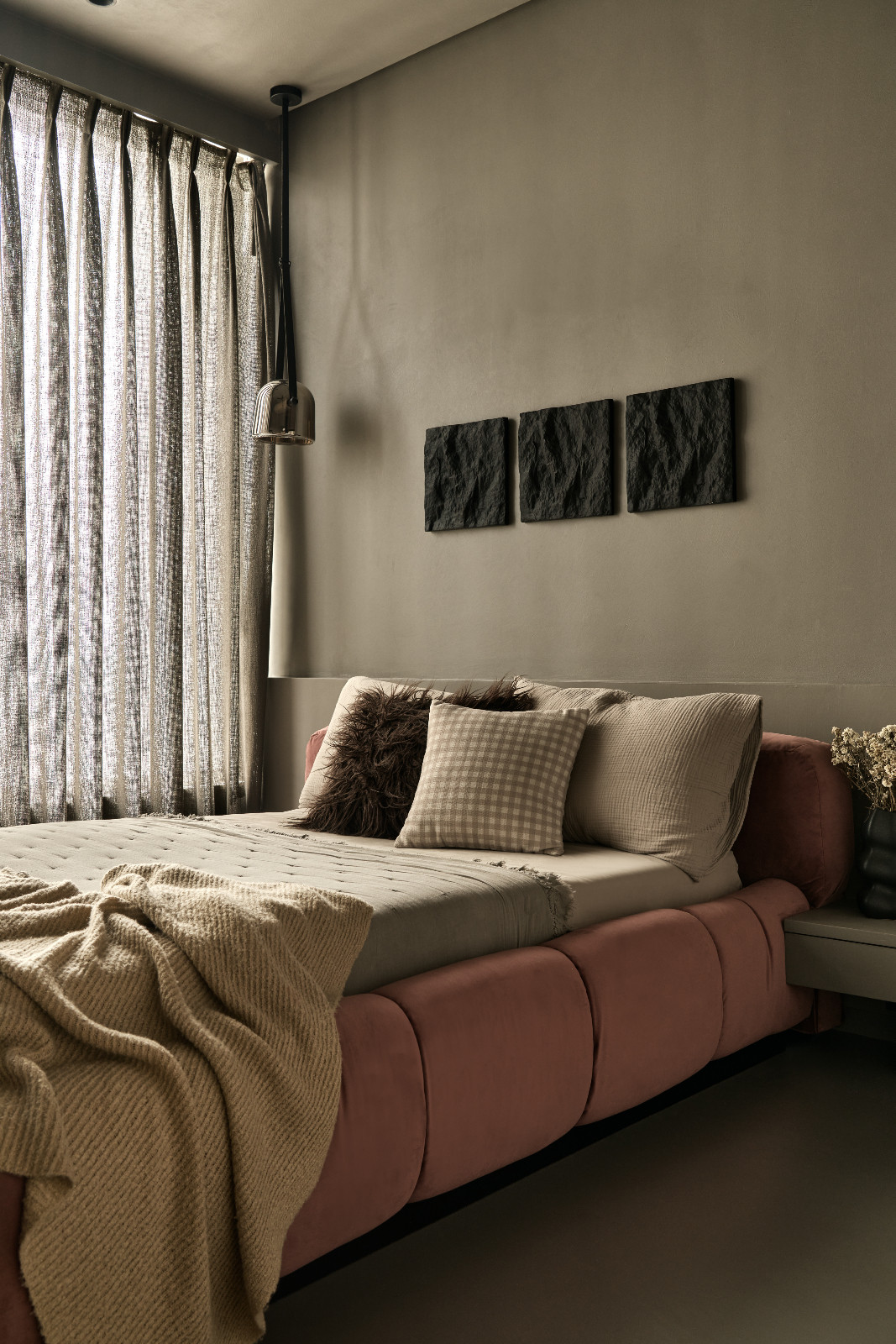 The bedroom of a Mumbai, India apartment designed by Dusq Studio