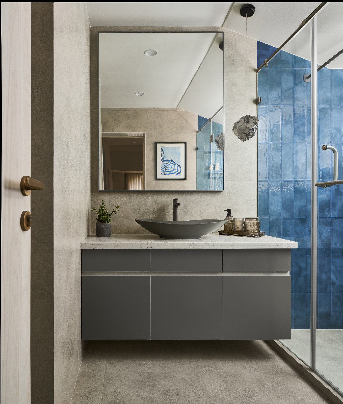 The bathroom of a family apartment in Mumbai, India designed by Dusq Studio