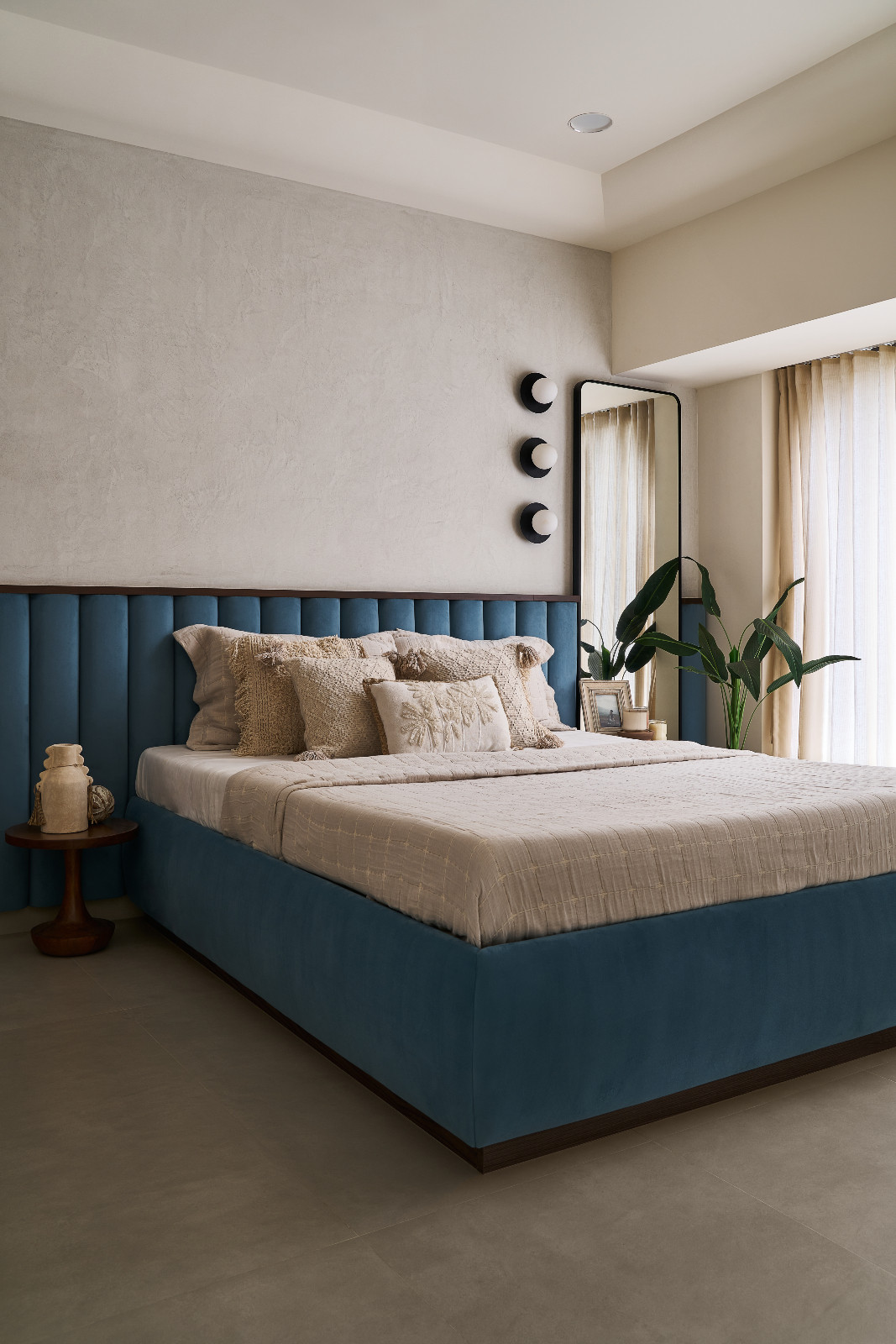 The bedroom of a family apartment in Mumbai, India designed by Dusq Studio