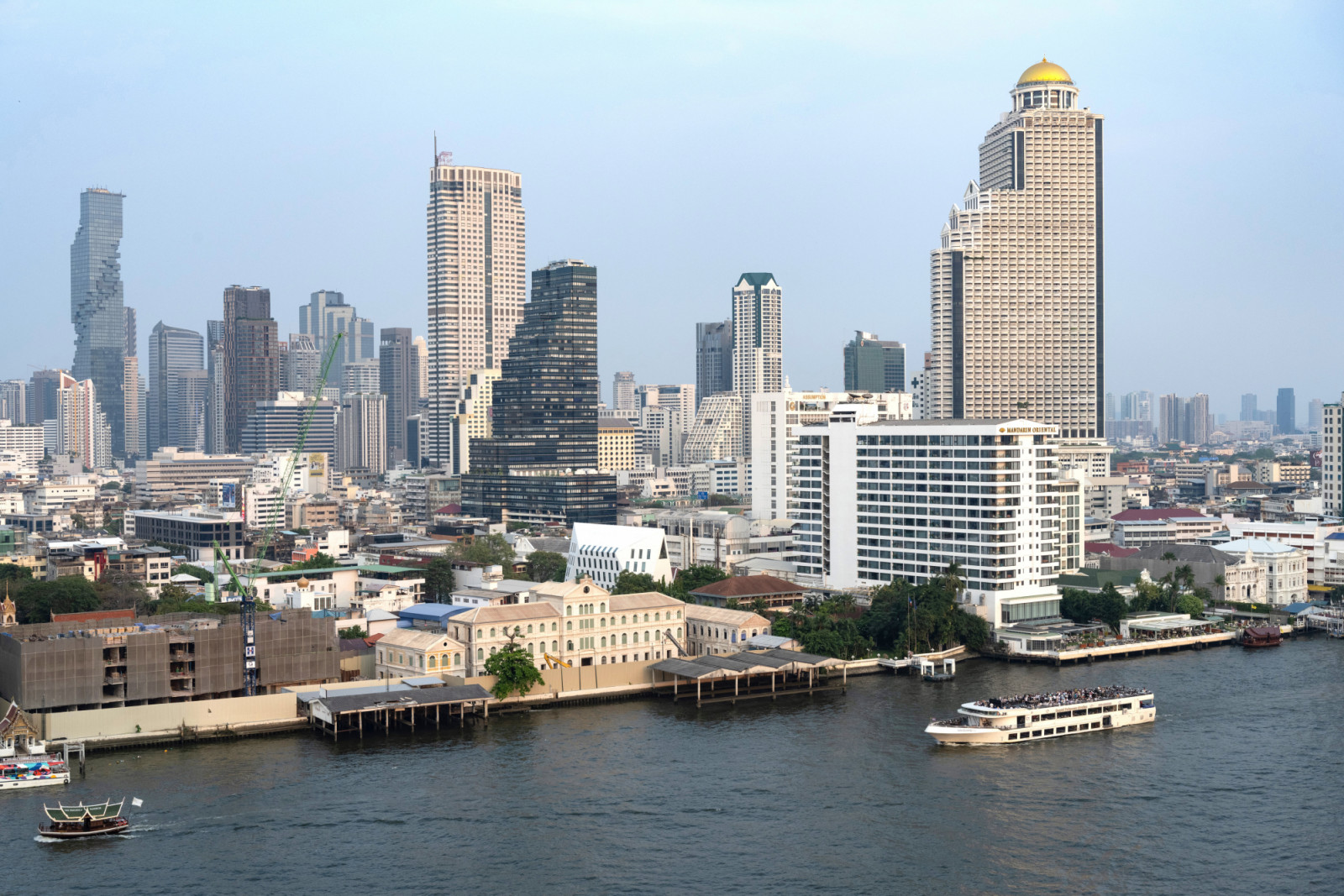 BANGKOK, THAILAND - 2025/03/20: River cruise on the Chao Phraya River with the modern city skyline of high rise office and apartment buildings. (Photo by John Wreford/SOPA Images/LightRocket via Getty Images)
