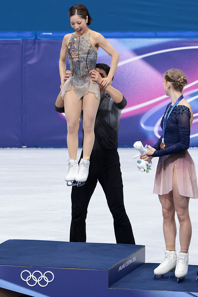 MILAN, ITALY - FEBRUARY 16: Gold medalists Riku Miura and Ryuichi Kihara of Team Japan during the victory ceremony of the Figure Skating Pair Skating event on day ten of the Milano Cortina 2026 Winter Olympic Games at Milano Ice Skating Arena on February 16, 2026 in Milan, Italy. (Photo by Jean Catuffe/Getty Images)