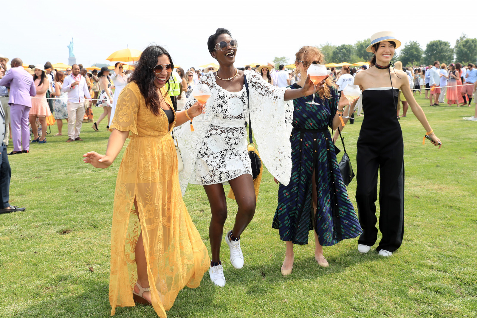 JERSEY CITY, NJ - JUNE 04: Guests take part in a divot stomp during the Ninth Annual Veuve Clicquot Polo Classic at Liberty State Park on June 4, 2016 in Jersey City, New Jersey. (Photo by Neilson Barnard/Getty Images for Veuve Clicquot)