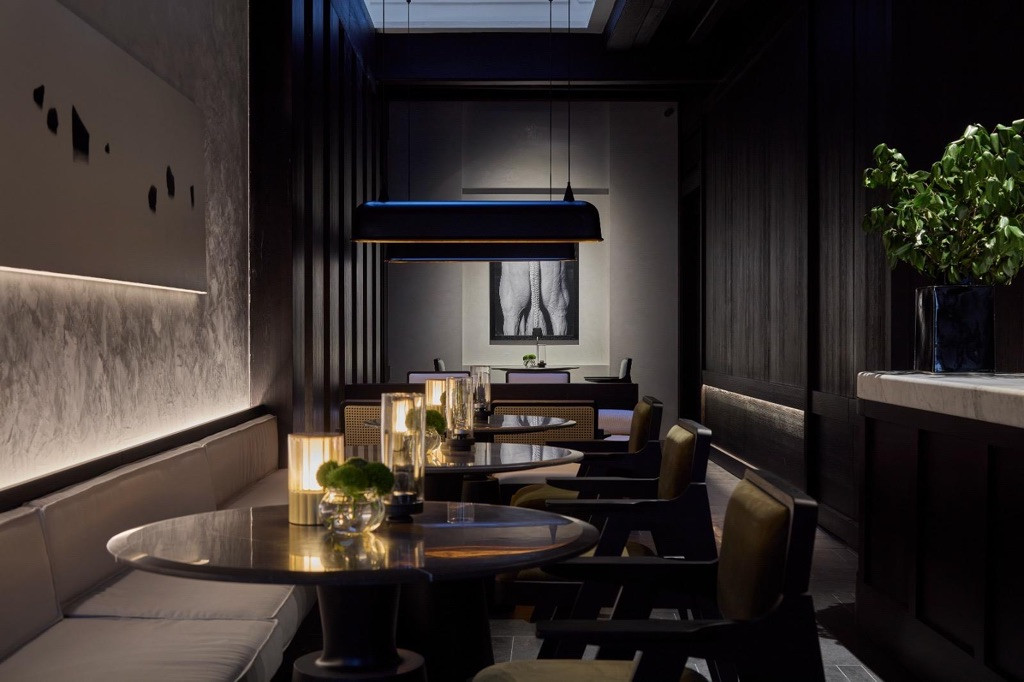 The restaurant embodies the play of darkness and punctuated light that Chan traces back to his earliest memories of shophouse living