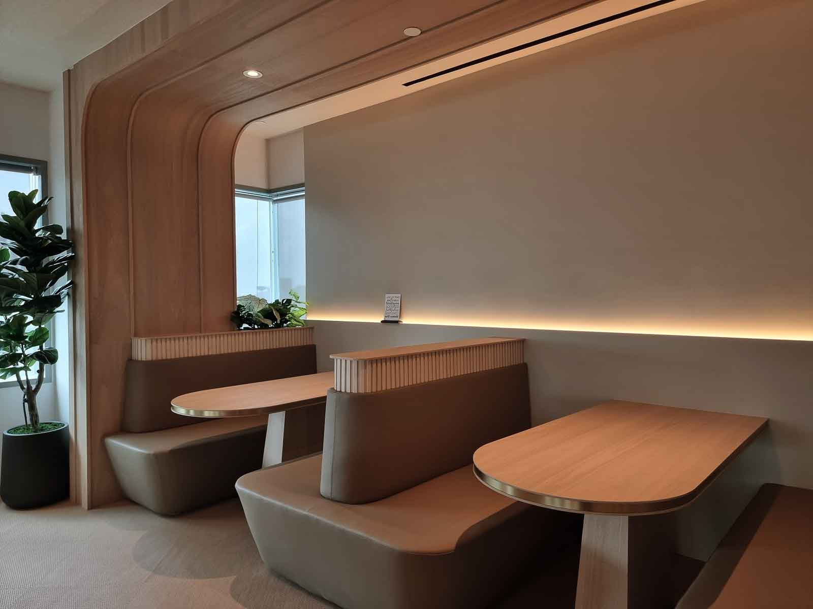 Banquette seating fosters a more intimate air in this collaboration space
