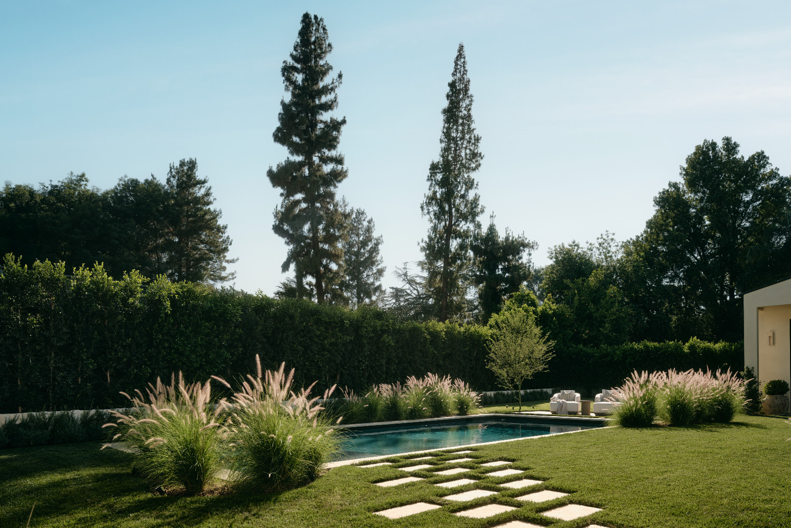 The outdoor pool area of a Tuscan-inspired Los Angeles, California home designed by Lidan Sfadia and Edward Grigoryan