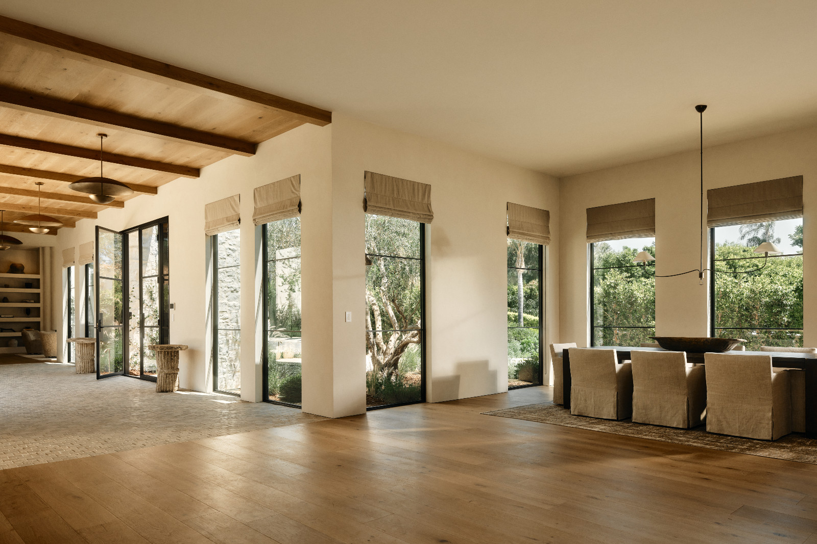 The dining room of a Tuscan-inspired Los Angeles, California home designed by Lidan Sfadia and Edward Grigoryan