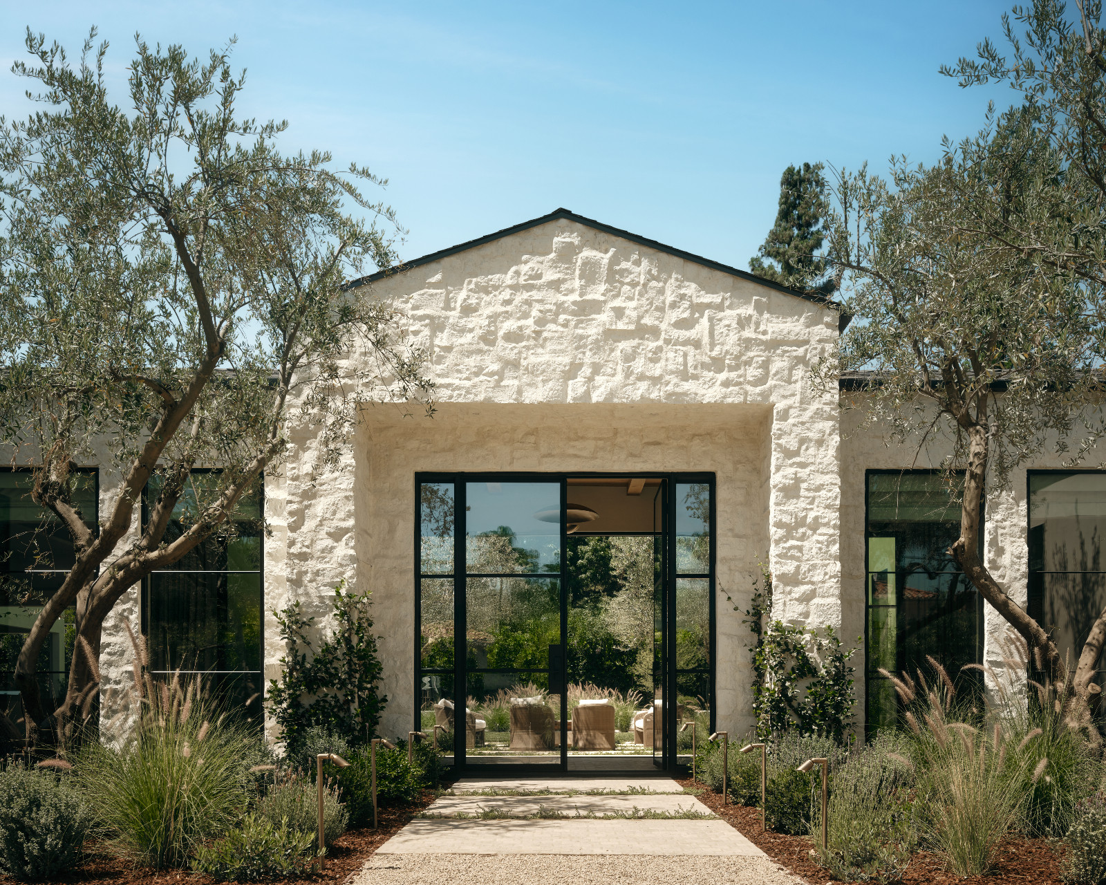 The exterior of a Tuscan-inspired Los Angeles, California home designed by Lidan Sfadia and Edward Grigoryan