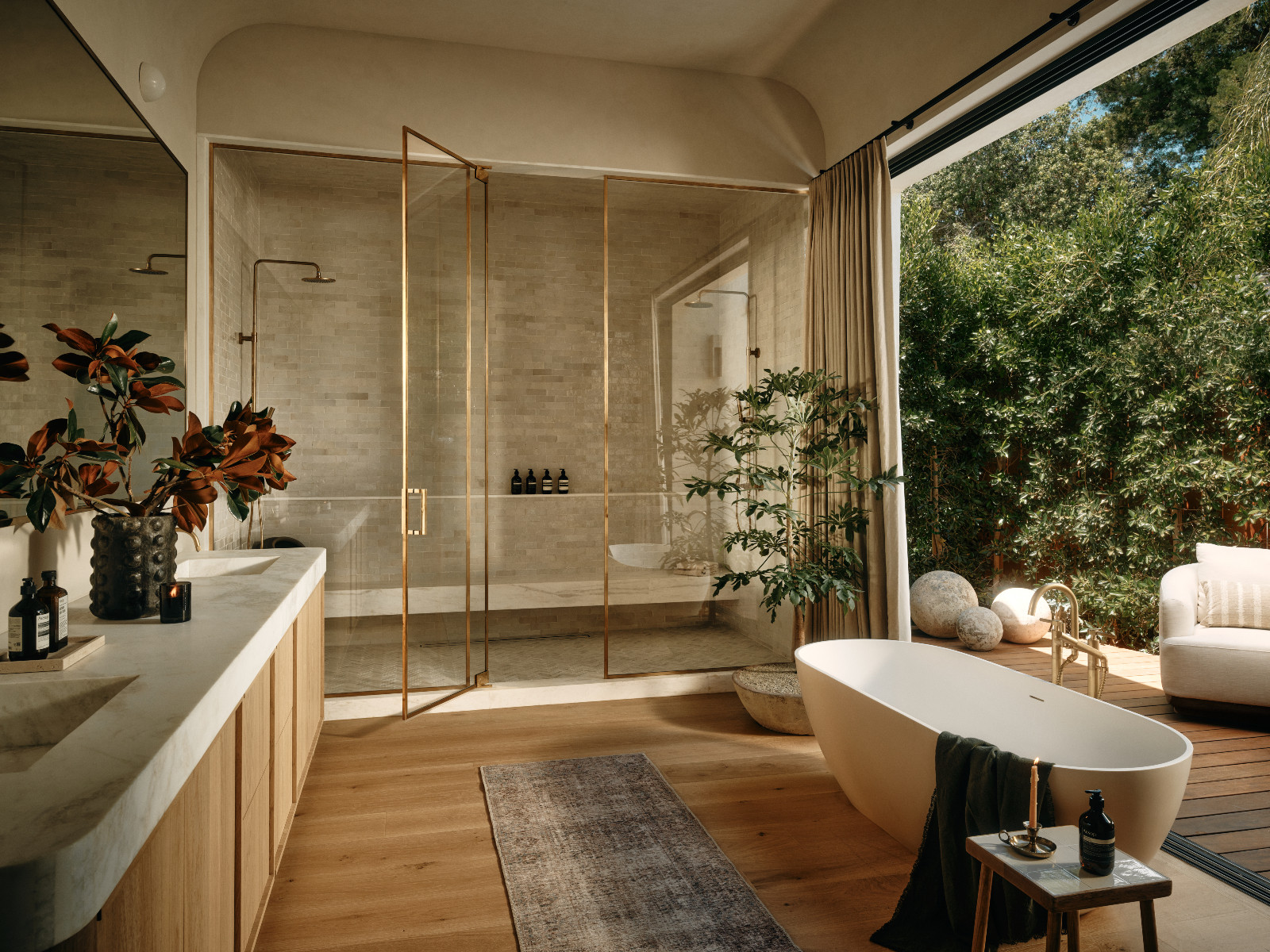The primary bathroom of a Tuscan-inspired Los Angeles, California home designed by Lidan Sfadia and Edward Grigoryan