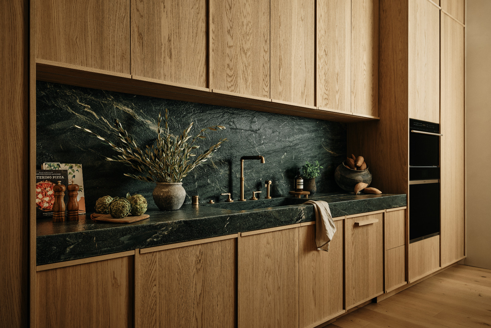 The kitchen of a Tuscan-inspired Los Angeles, California home designed by Lidan Sfadia and Edward Grigoryan