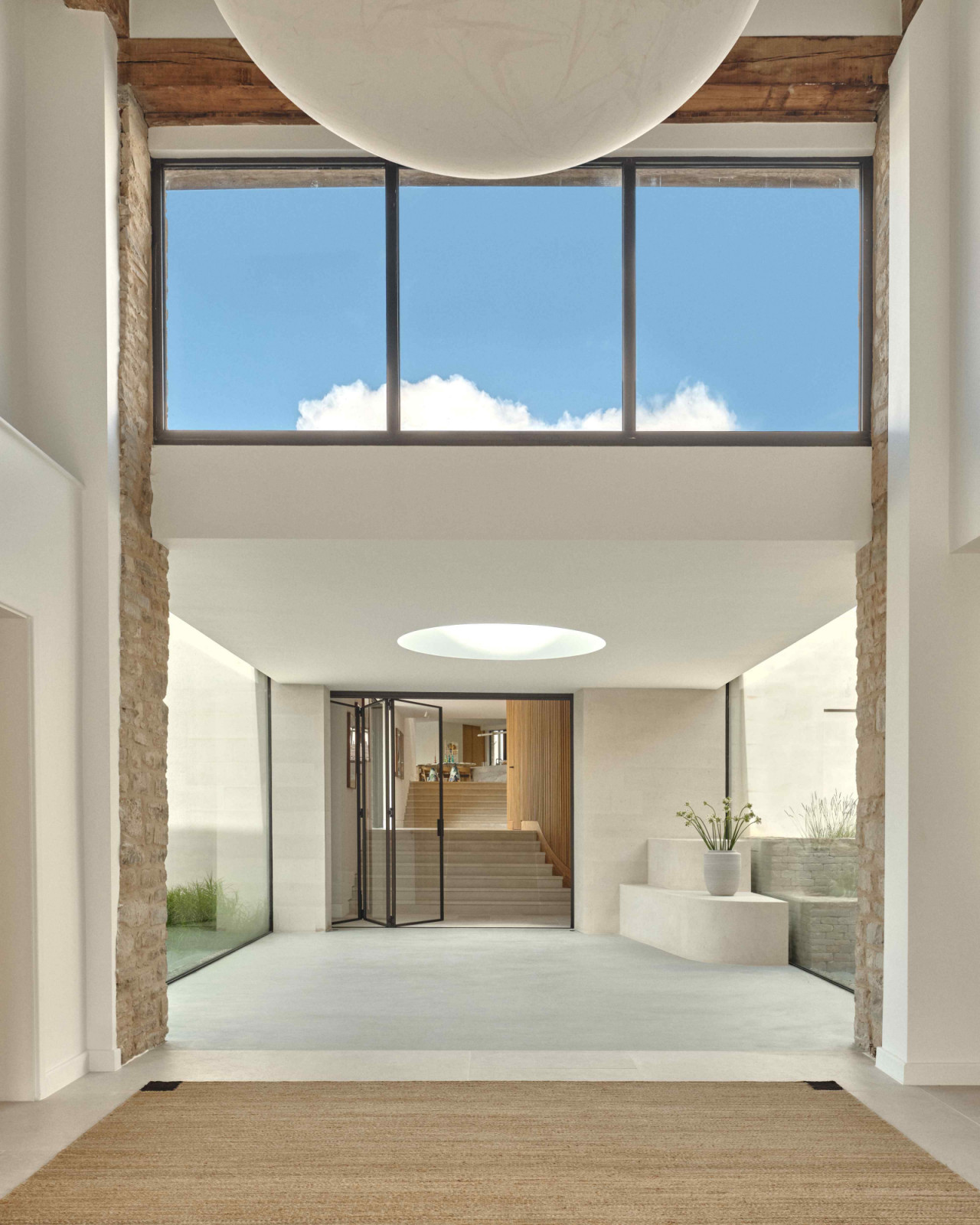 The double-height entrance hall with original timber beams