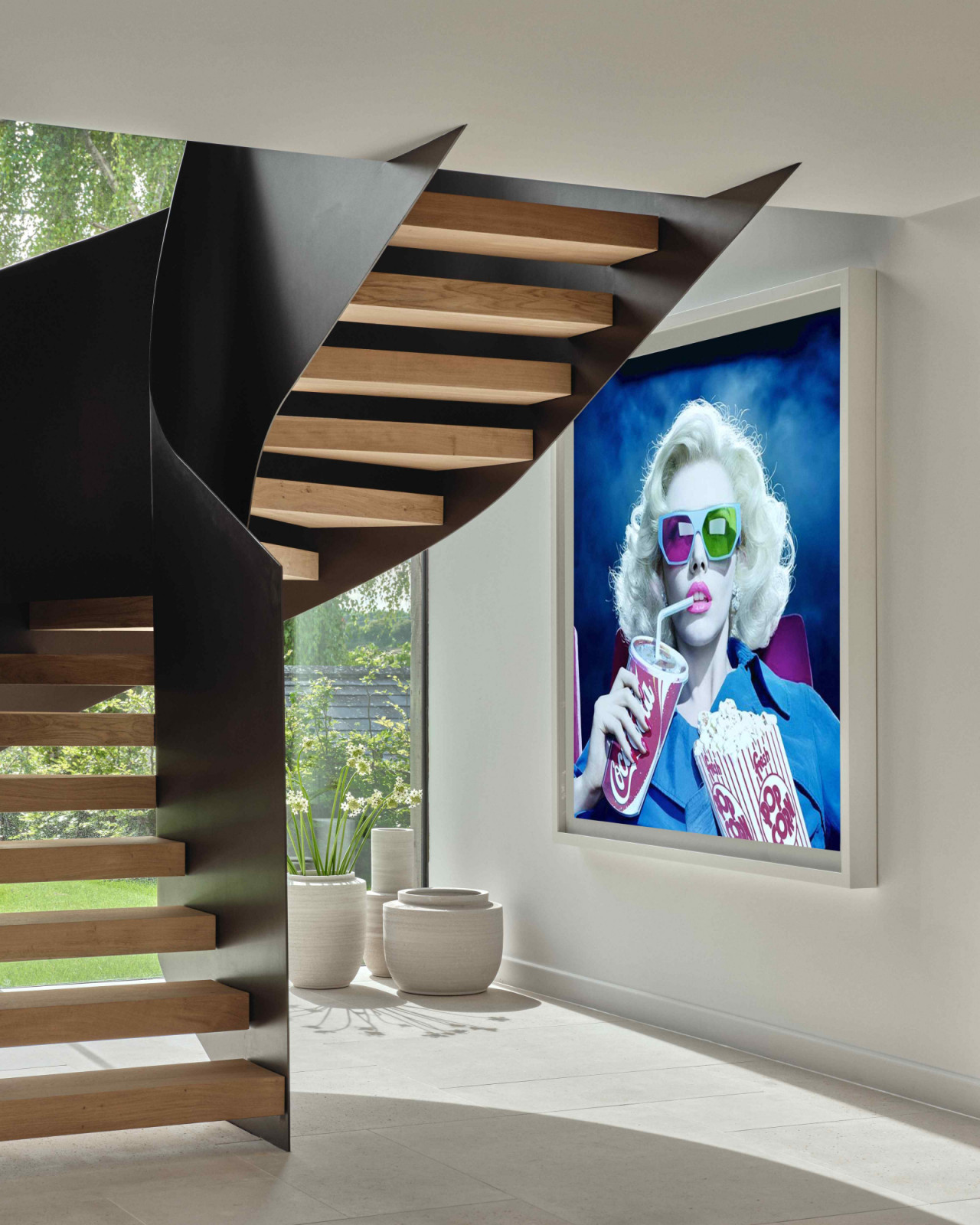 A metal staircase and balustrade underscores the interplay between tradition and modernity