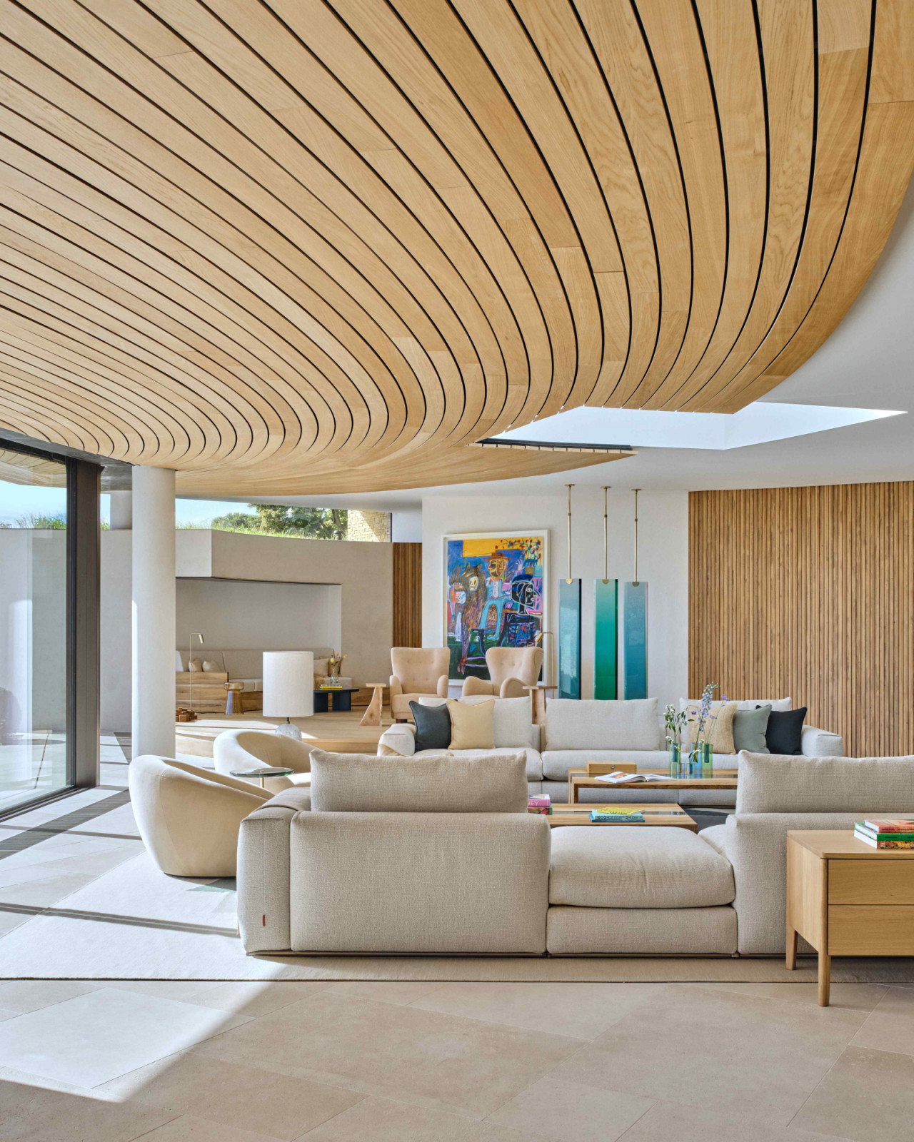 The curved timber ceiling defines the room with a sense of movement