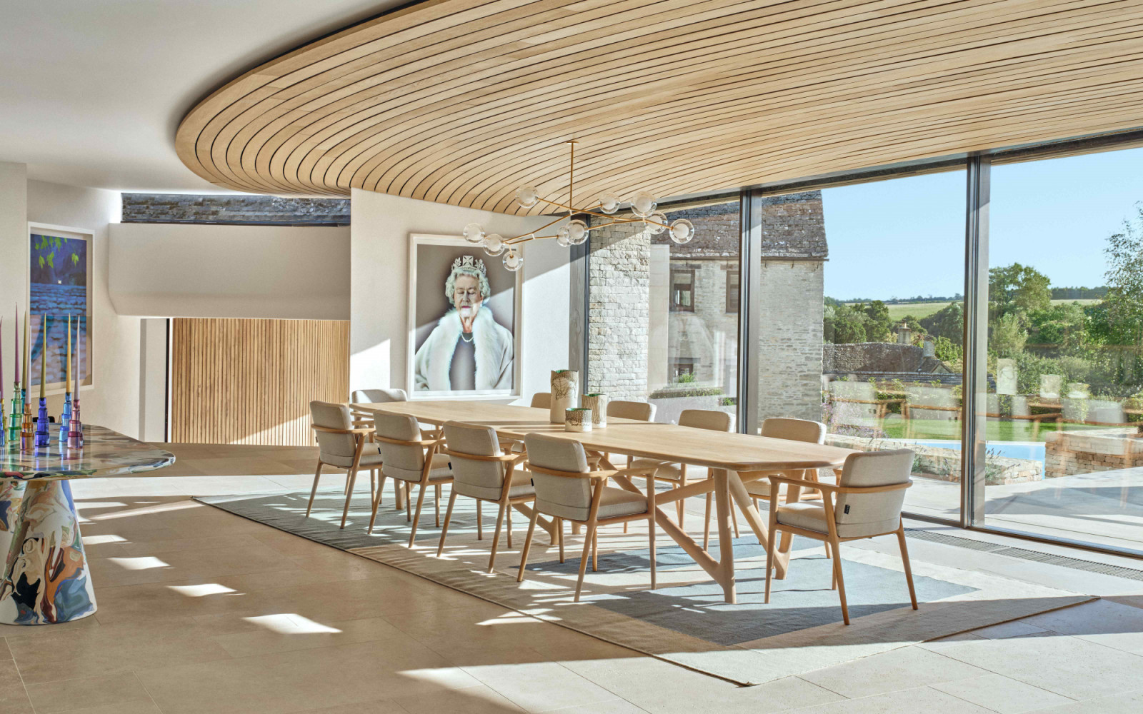The dining area with a bespoke dining table by Dominic Ash, dining Chairs by Moooi, and pendant light by Giffin Design