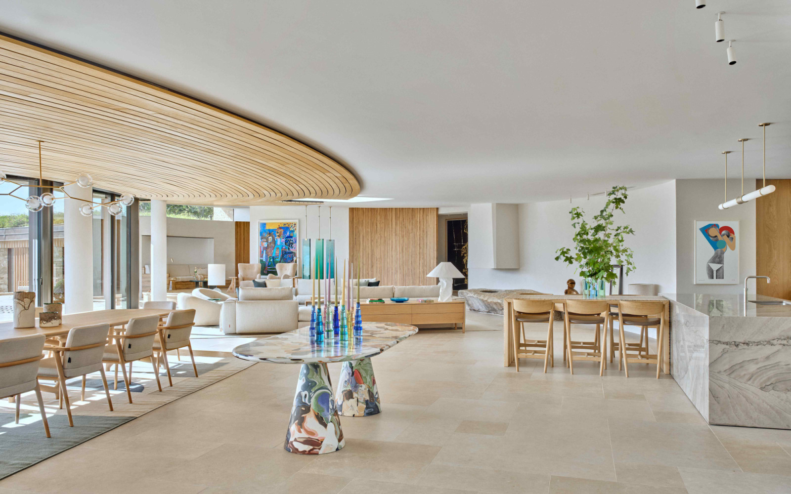 The open-plan space comprises the kitchen, dining and living areas