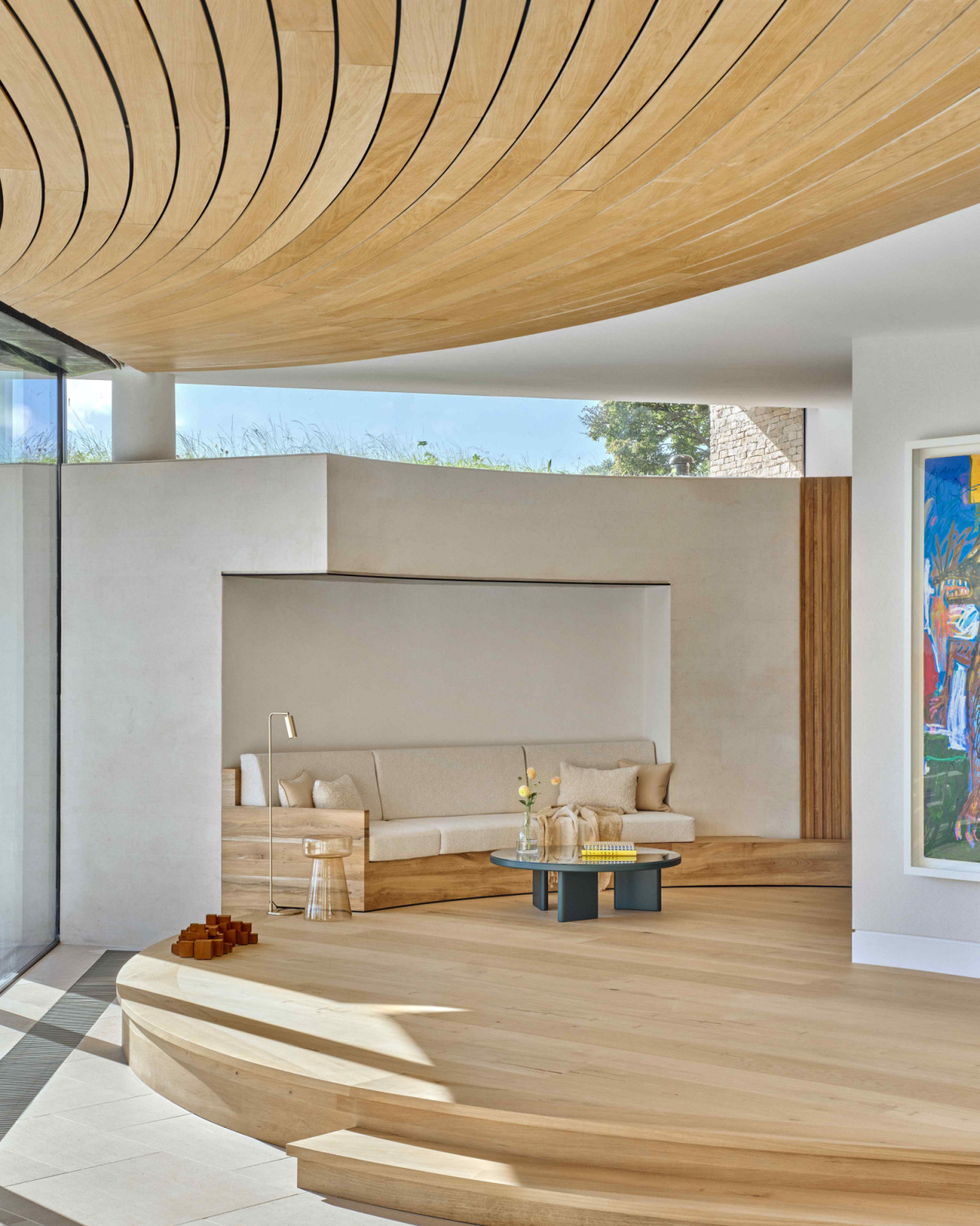 The raised podium sitting area with clear sightlines of the original stone barn