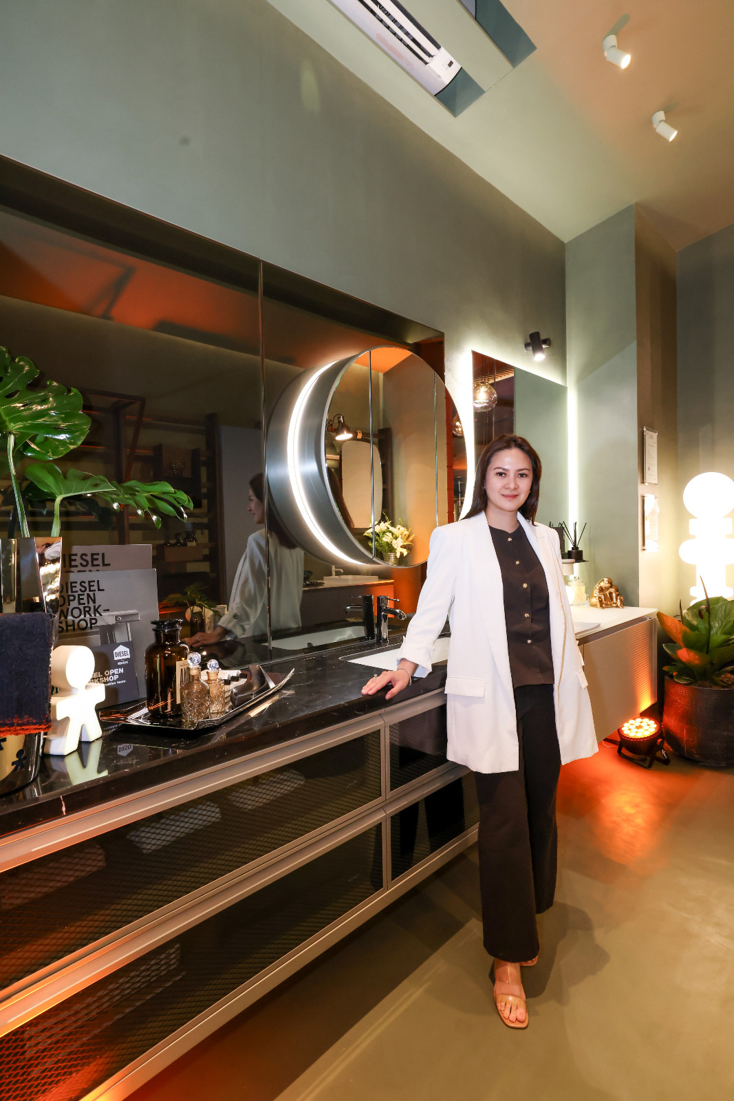 Interior designer Iris Ocampo with the bathroom and home gym vignette she designed for Scavolini's new showroom at the Proscenium at Rockwell