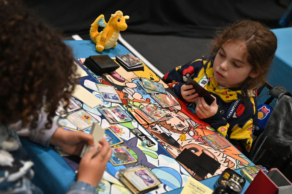 Young competitors play Pokémon cards during the during the Pokémon European International Championship 2025 in London in 2025. Players play to earn enough points for an invitation to the World Championships (Images: Getty Images)