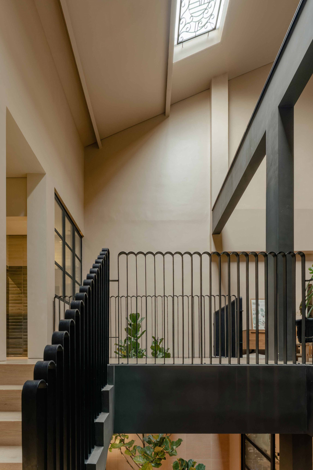 The house’s old door and window grilles inspired the design of these new staircase handrails