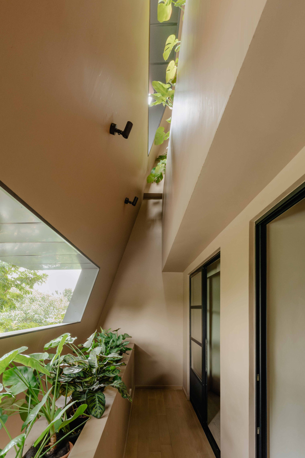 The balcony shared by the two younger children overlooks the car porch while their parents’ balcony overlooks it from above