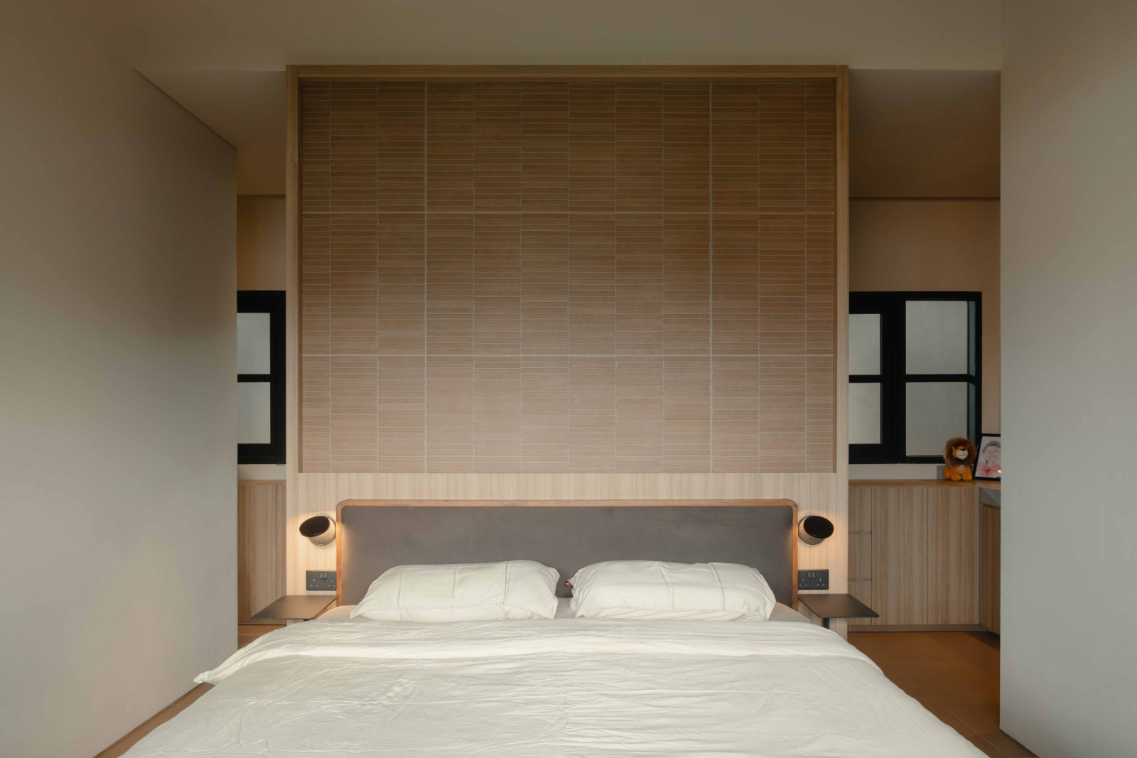 The restful master bedroom features a neutral colour palette