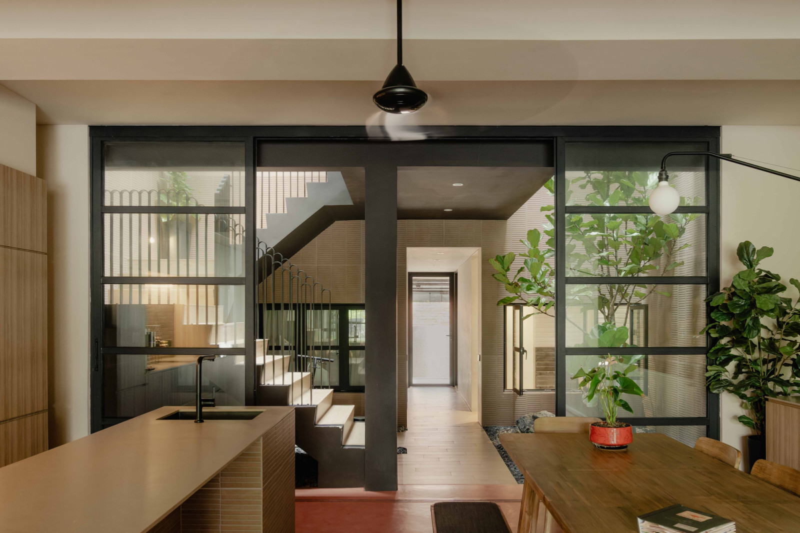 The view from the dining area and dry kitchen into the new courtyard;
