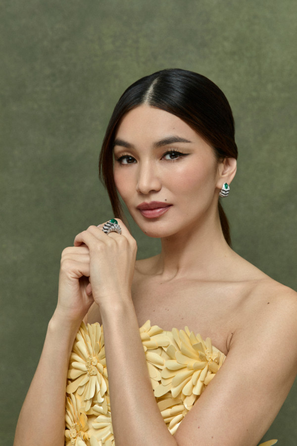 Gemma Chan wears En Équilibre Axialis earrings and ring; Balenciaga dress