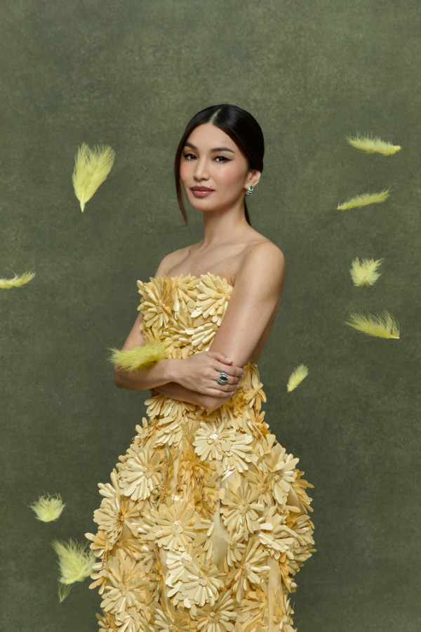 Gemma Chan wears En Équilibre Axialis earrings and ring; Balenciaga dress