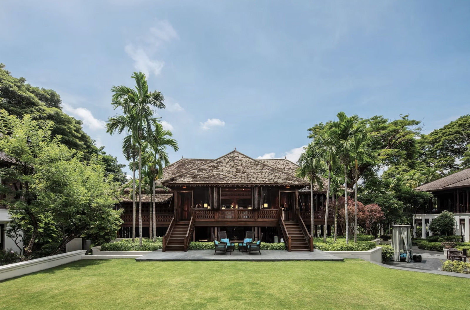 The 1889 teak house which was originally the northern headquarters of the Borneo Company viewed from the lawn at 137 Pillars House, Chiang Mai