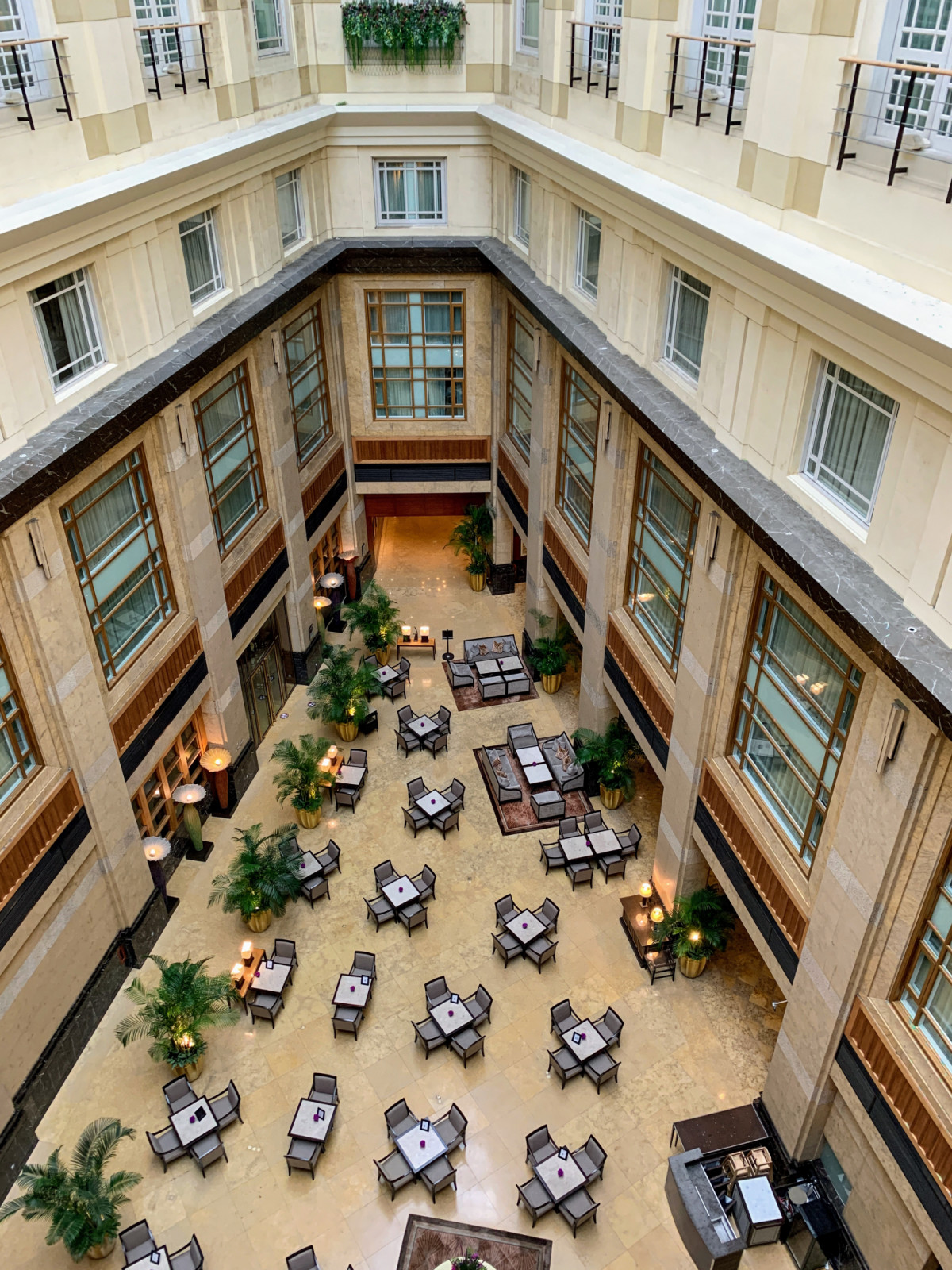 The central sky-lit atrium, created by Architects 61 during the hotel conversion, involved demolishing almost the entire original interior. Guest rooms ring both levels, with inner-facing rooms overlooking the courtyard below