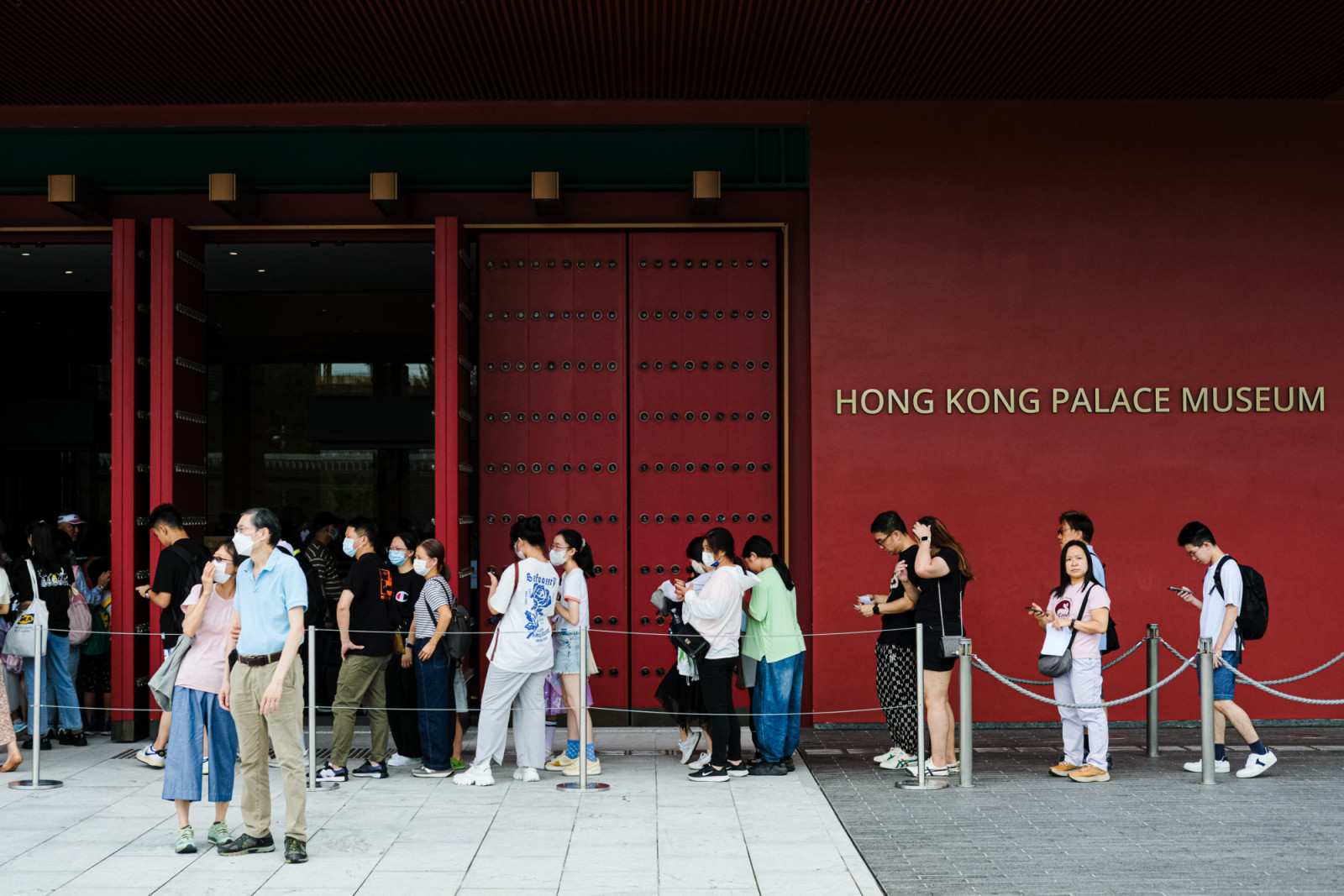 HONG KONG, CHINA - JULY 1: People wait in line outside Hong Kong Palace museum for free admission offered by the Hong Kong government during the 26th handover anniversary on July 1, 2023 in Hong Kong, China. Hong Kong is marking the 26th anniversary of its handover from Britain to China on July 1. (Photo by Sawayasu Tsuji/Getty Images)