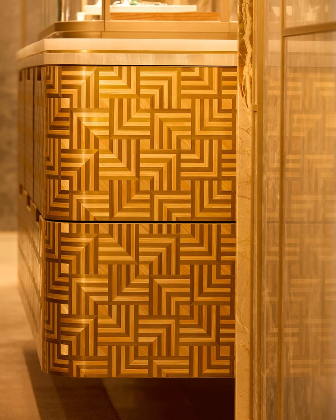 Cabinets with dédale straw marquetry patterns in the Cartier boutique in Berlin (Photo: Instagram / @atelierslisondecaunes)