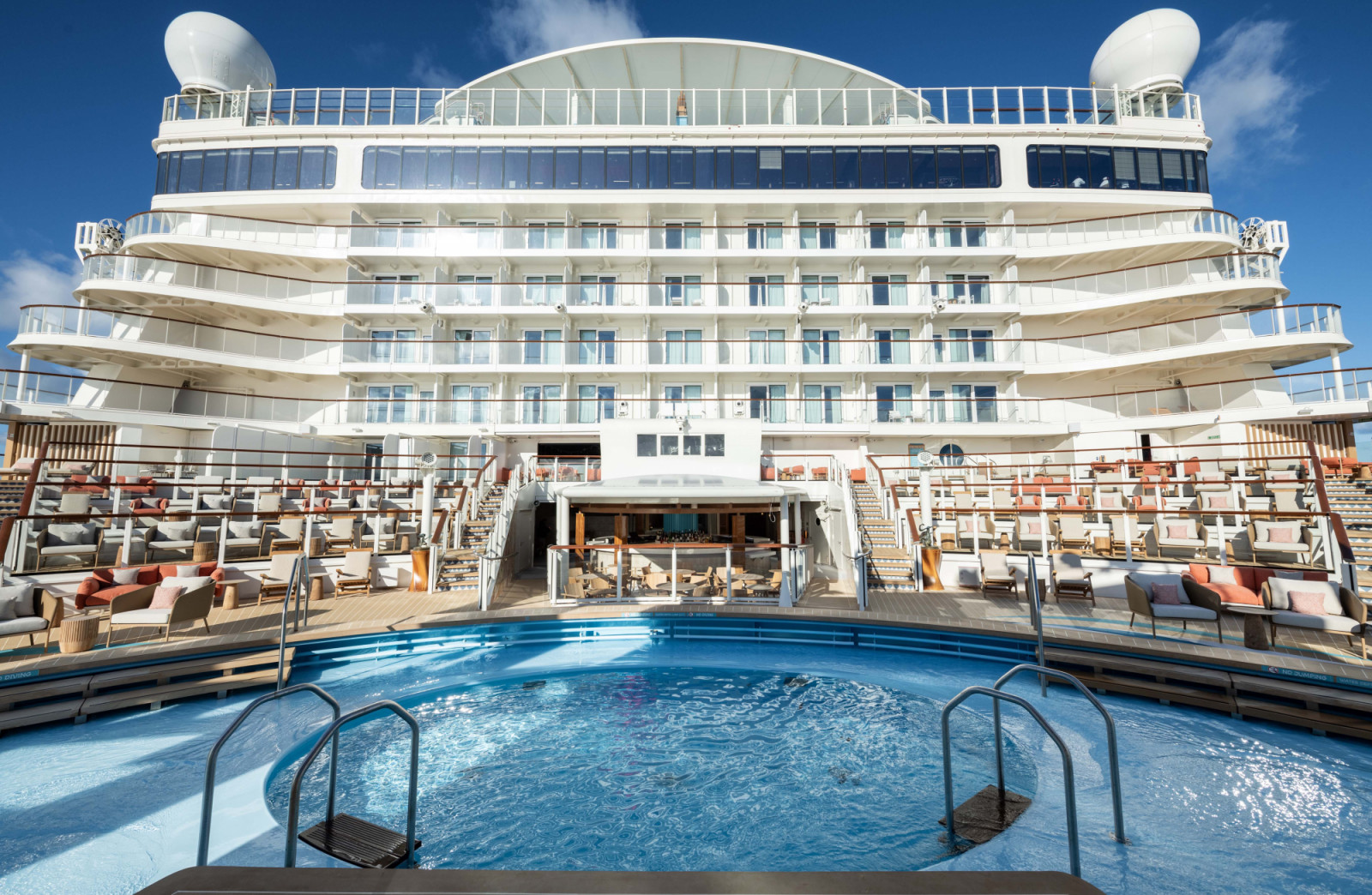 Wayfinder Bay, an open-air oasis under the sun, is where relaxation and exclusive entertainment await onboard the Disney Adventure. Tucked away at the back of the ship, this tranquil pool area features plush seating and loungers arranged among tiered decks, offering some of the most stunning views of land, sea and sky. (Kent Phillips, photographer)
