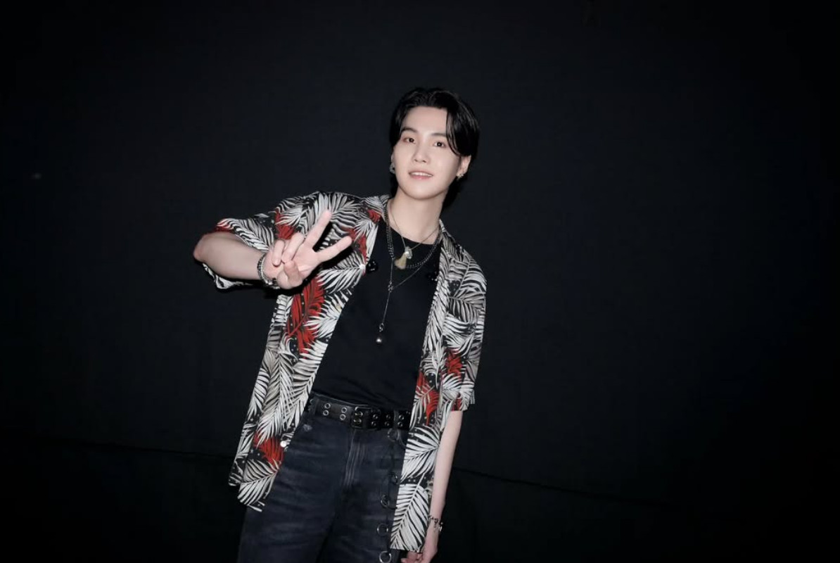 Suga wears a vibrant Gucci forest-print bowling shirt during his D-DAY tour (Photo: @agustd/Instagram)