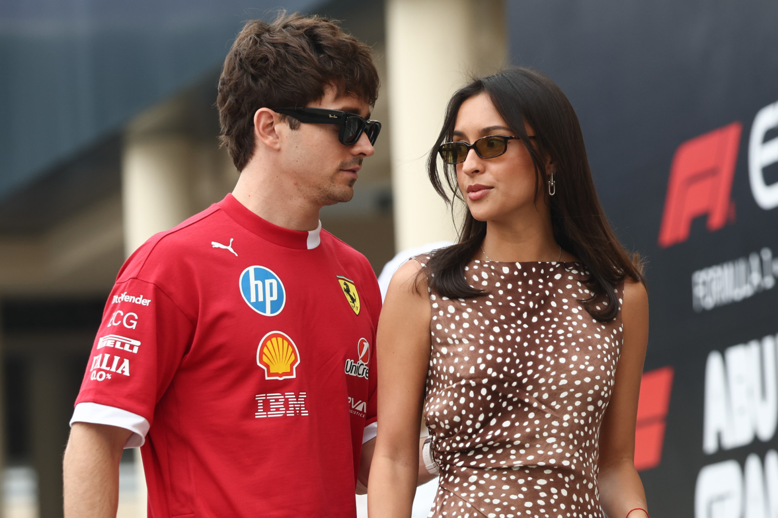 Charles Leclerc of Ferrari and Alexandra Saint-Mleux before the first practice ahead of the Formula 1 Abu Dhabi Grand Prix at Yas Marina Circuit in Abu Dhabi, United Arab Emirates on December 5, 2025. (Photo by Jakub Porzycki/NurPhoto via Getty Images)