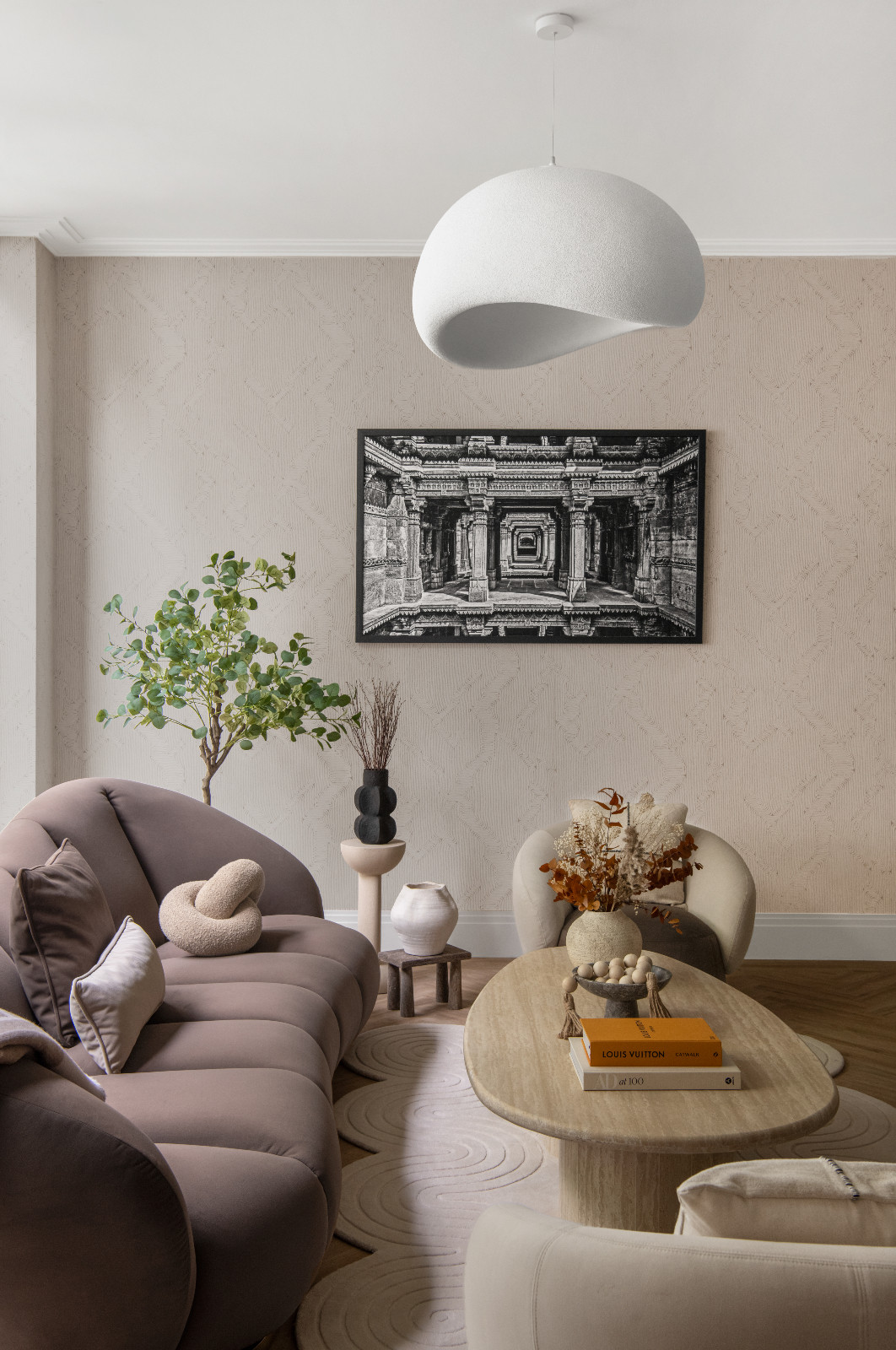 The blend of wabi-sabi elements and Indian craftsmanship on display in the living room of a London, England home designed by Aashni Kumar
