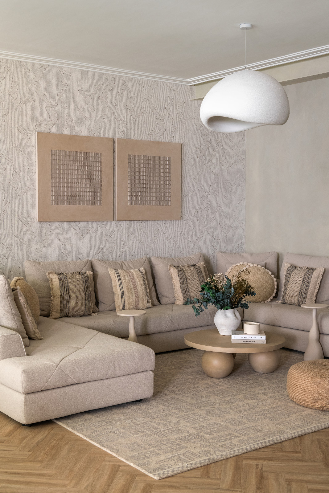 The blend of wabi-sabi elements and Indian craftsmanship on display in the living room of a London, England home designed by Aashni Kumar