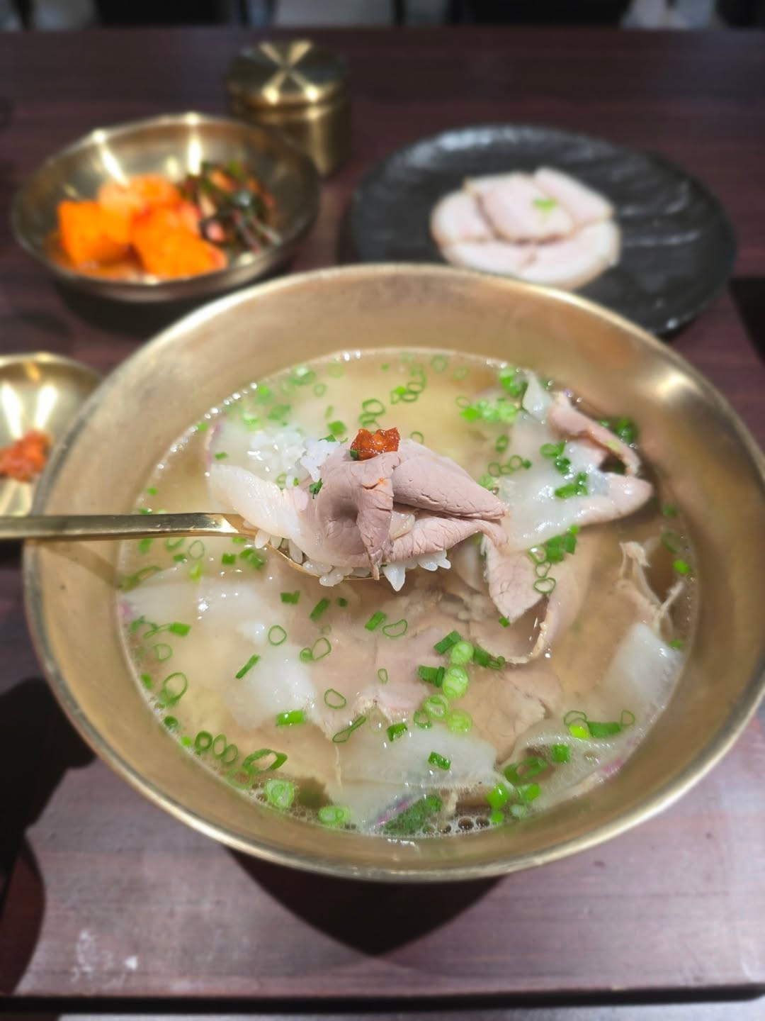 A hearty pork-bone soup served with rice, offering a rich, savoury taste rooted in Busan’s post-war culinary history (Photo: ordinary_korea/Instagram)