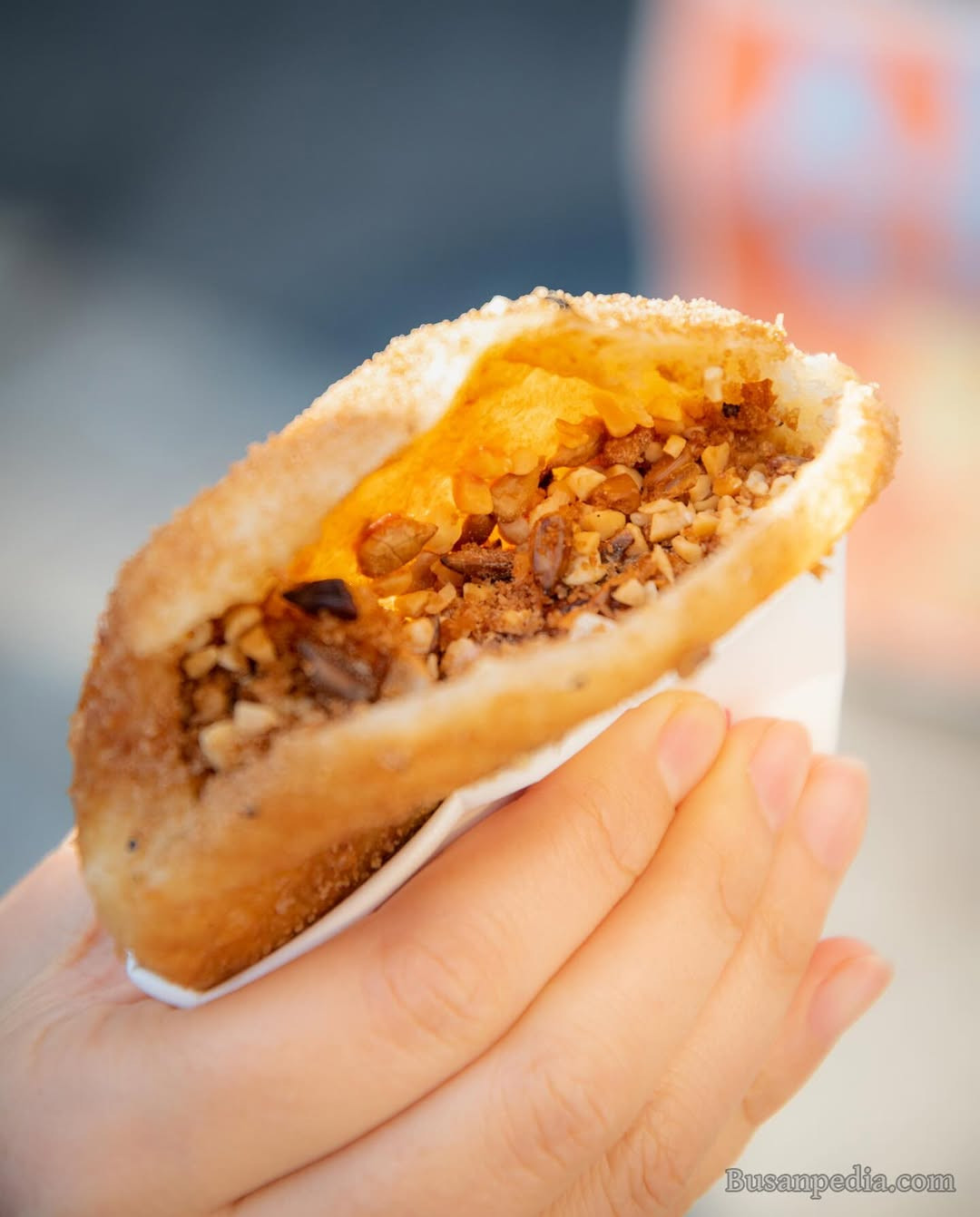 A crisp, sweet pancake filled with caramelised brown sugar, nuts and seeds, perfect for a quick snack on Busan streets (Photo: busanpedia/Instagram)