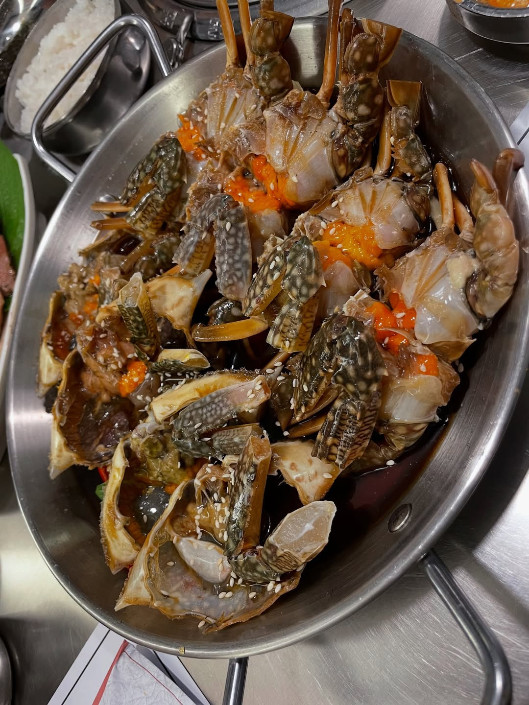Raw crab cured in a soy-based brine, offering a salty, umami-rich taste that reflects Busan’s seafood tradition (Photo: unarorimpandeyofficial/Instagram)