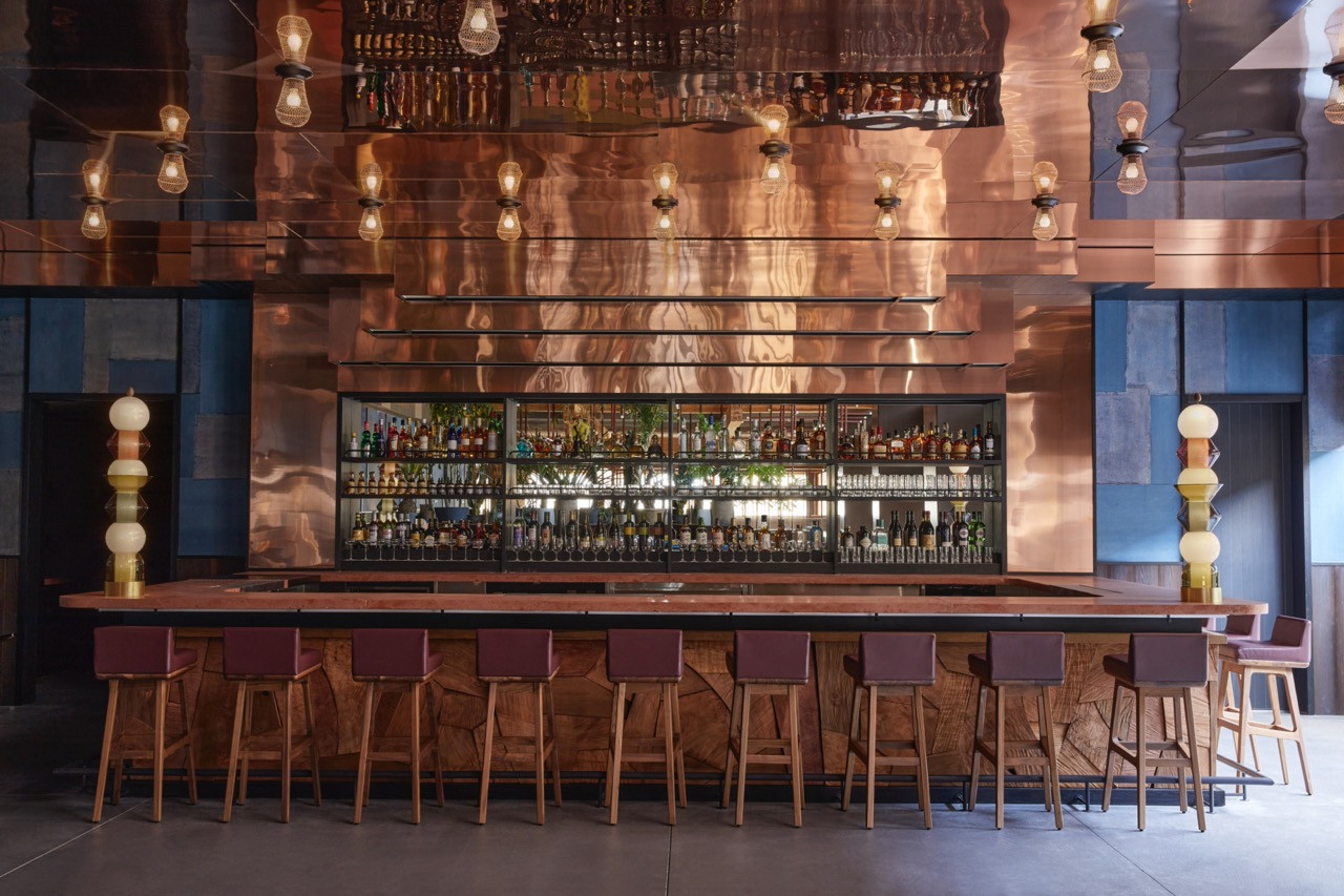 The PIOPIKO bar at Ace Hotel Kyoto, with its copper-clad back wall and custom lighting by the late folk artist Samiro Yunoki