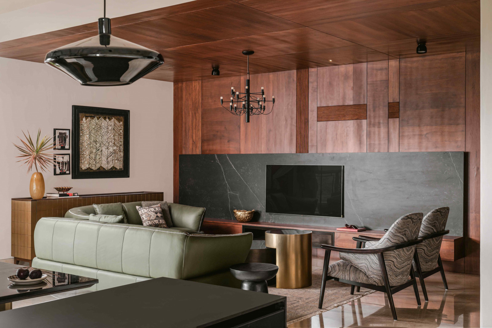 A cohesive composition of materials, artworks, and furnishings in the eclectic home