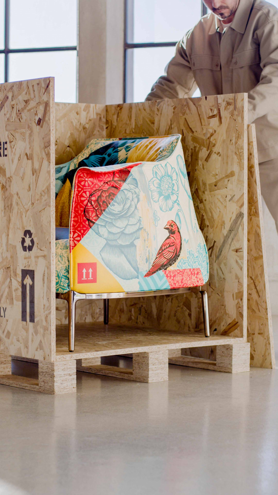 The Archibald Delicate Balance armchair revealed inside its custom crate printed with Shepard Fairey’s artwork