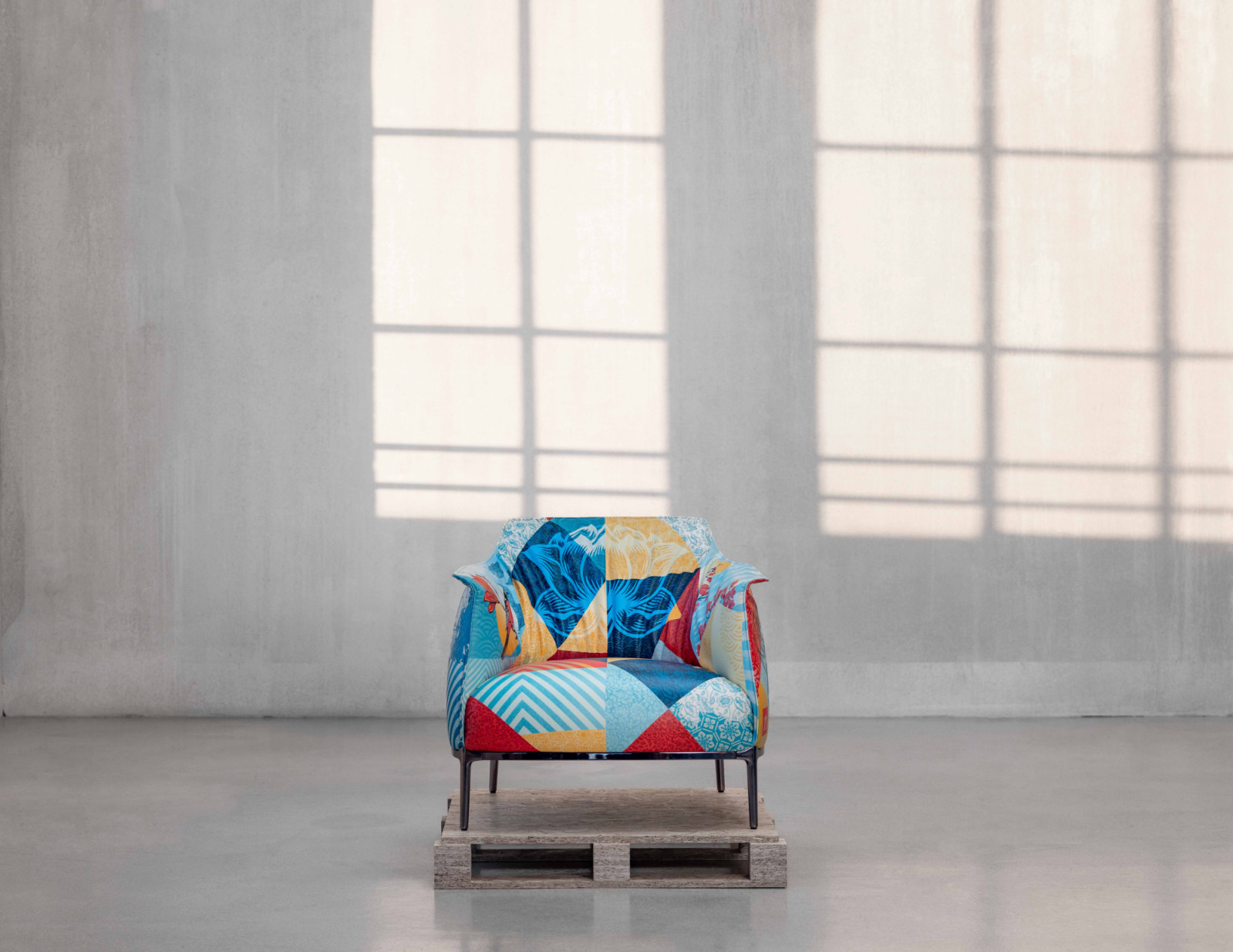 The front view of Archibald Delicate Balance Limited Edition armchair by Poltrona Frau, featuring artwork by Shepard Fairey printed on Pelle Frau leather