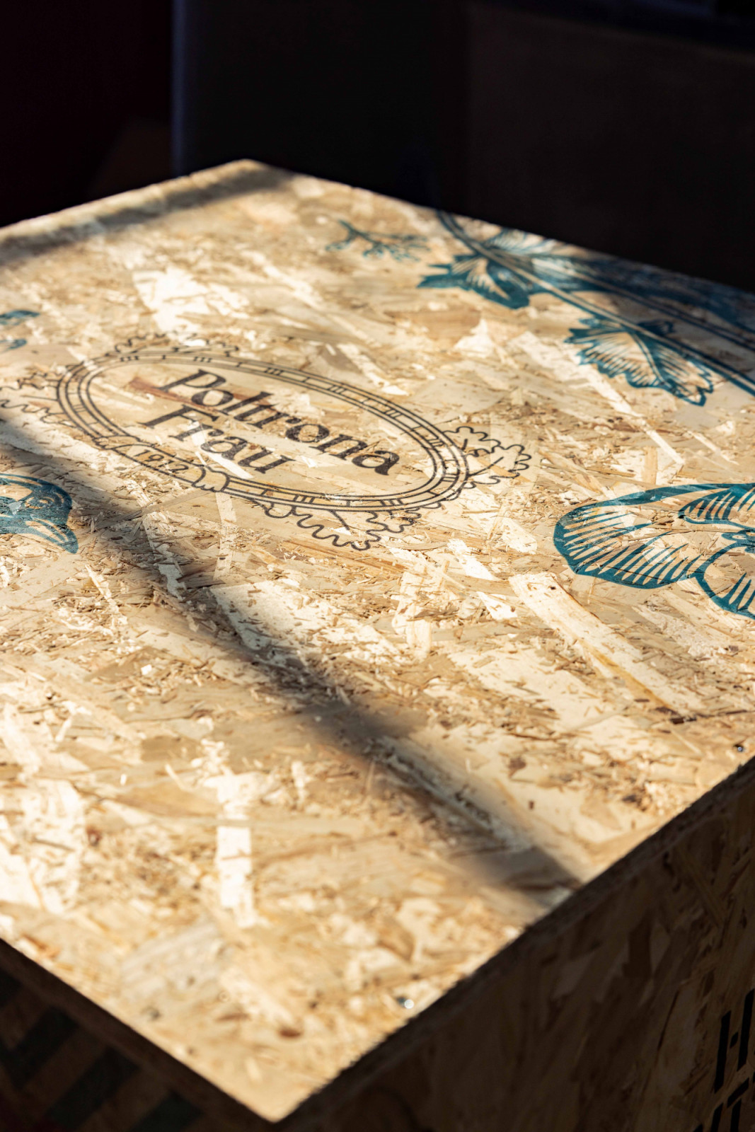 The Poltrona Frau logo stamped on the crate underscores the chair’s craftsmanship and provenance