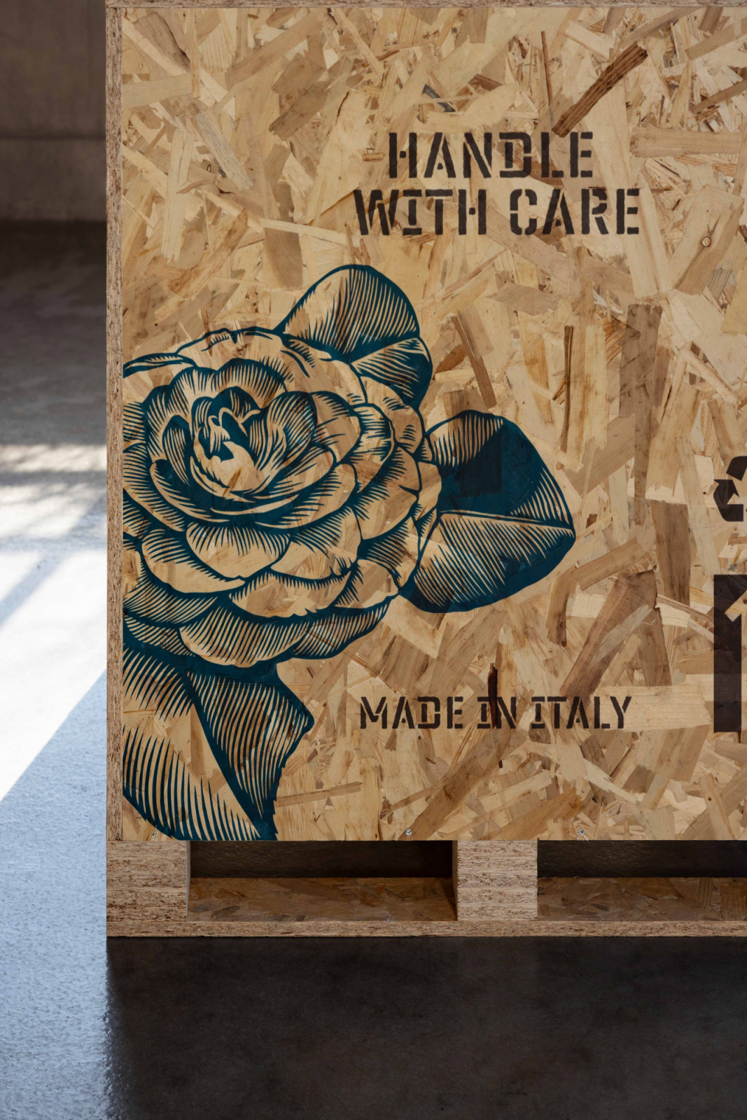 The chair arrives in a crate adorned with Shepard Fairey’s blue rose motif