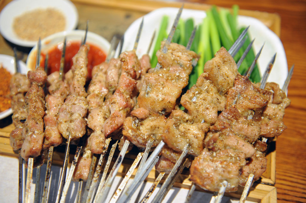 WEIFANG, CHINA - APRIL 28: People enjoy a barbecue feast at a restaurant one day before the five-day May Day Holiday on April 28, 2023 in Weifang, Shandong Province of China. (Photo by Wang Zhide/VCG via Getty Images)